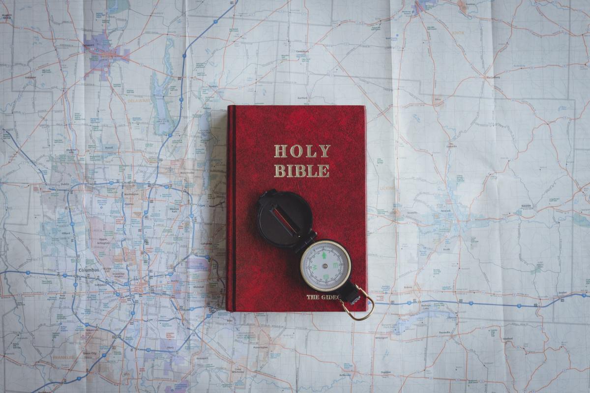 An open Bible on a wooden table
