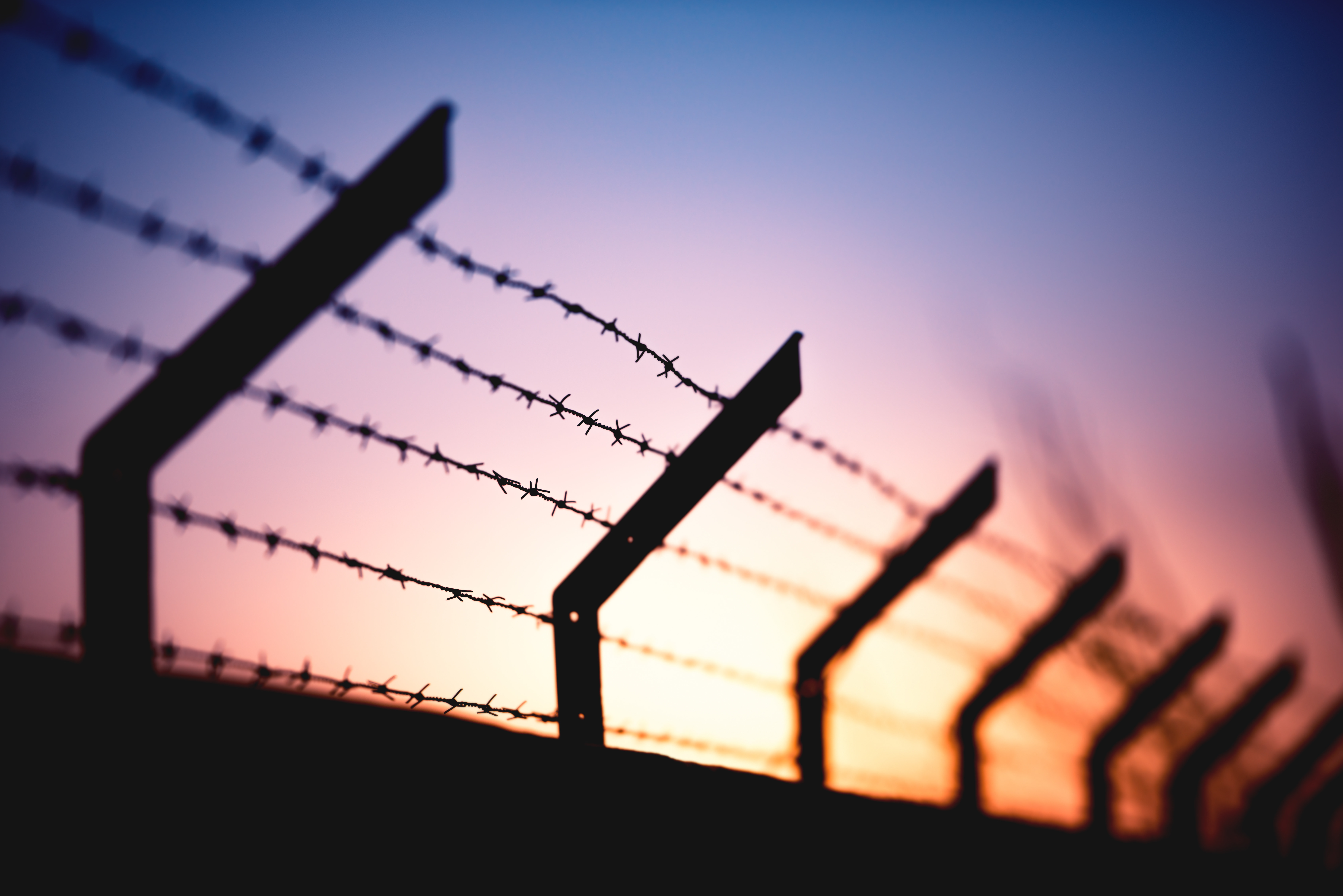 A sunset behind a wall